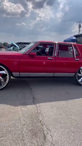 Red box Chevy on 28” billets riding