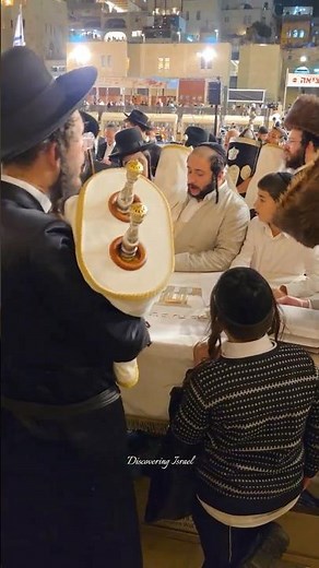 Jews celebrate the Simchat Torah holiday at the Western Wall in Jerusalem, Israel, in 2025
