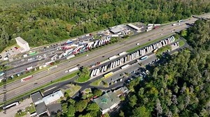 Traffic on highway and rest area. Drone point of view