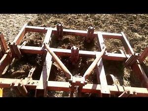 Kubota M7060 with Bushug 7 shank chisel plow