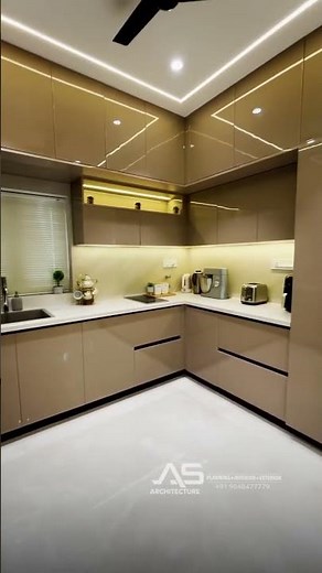 A sleek modular kitchen with glossy finishes, smart storage, and modern elegance.