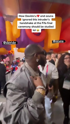 Davido and Ozuna Ignoring Intruder's Handshake at FIFA Final Ceremony - Viral Video Analysis