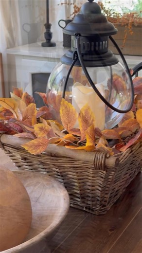 675K views · 9.1K reactions | Simple and pretty fall centerpiece using a basket, a fall wreath or garland and a lantern. Comment FALL LANTERN and I’ll send you the details for this beautiful lantern that includes a timer, remote and 2 seasonal candle rings! #falldecor | Mother Thyme | Facebook