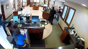 Surveillance photos show bank robbers in Nashua