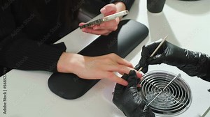 Nail service. Happy customer getting her nails done at beauty salon. Manicure specialist doing nails for woman client in modern studio. Stock Video