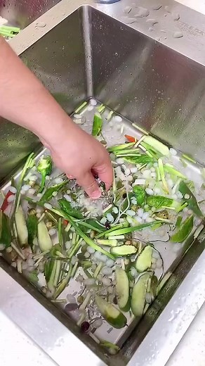 Washing and Draining Vegetables in the Kitchen Sink