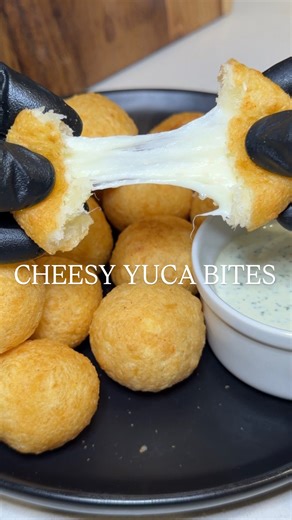 Alex Rios on Instagram: "Cheesy Yuca Bites 🇨🇺🔥 recipe ⬇️ 2 lbs yuca, fresh or frozen 3 tbsp melted butter 2 tsp garlic powder 8 oz mozzarella cheese, freshly shredded Boil yuca for 20-30 minutes or until just fork tender. Drain and set aside. Once cool, remove the vein and mash. Add butter and garlic powder. Mix thoroughly until a dough forms. Grab a tbsp of dough, form a well in the middle and stuff with cheese. Close it up and fry for 3-5 minutes until golden brown. Cilantro Garlic Sauce 1/