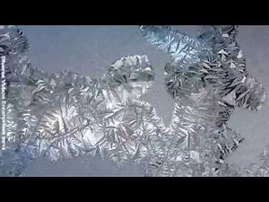Crystallized Ice Formation on Window Pane Inside House (Video)