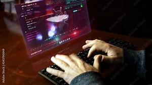 Man typing on the keyboard with virus alert on hologram screen on desk. Cyber security breach warning with worm symbol. System protection concept. Hand shake camera.