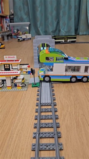 High-speed LEGO train crash at crossing next to vintage Shell station! 🚂💥