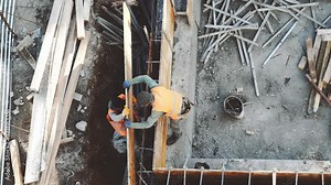 Industrial Building Workers Doing Job Raw Fundament Concrete Cement Using Tools Hard Job Labor Construction In Progress