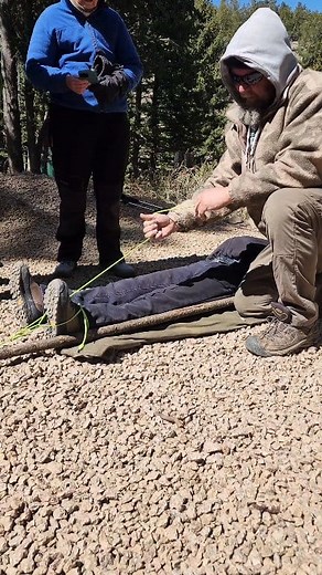 Wilderness medicine at its finest. This is a field-expedient traction splint we rigged during our Wilderness First Responder training with Offgridmedic up at The Survival University. Just a sturdy stick, a belt, and a shoelace (or in this case paracord) — but it could mean the difference between stable transport and permanent damage in the backcountry. In the event of a femur fracture, the muscles contract and pull the broken bone ends upward, often making the injured leg appear shortened and sw