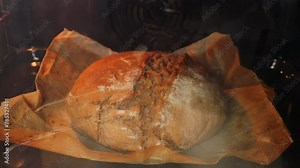 A timelapse of artisan bread in the oven. Preparation of homemade sourdough bread.