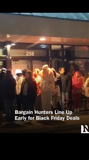 A long line of bargain hunters, wrapped up against the cold, could be seen outside a Target store in Missouri early on Black Friday. | Newsweek