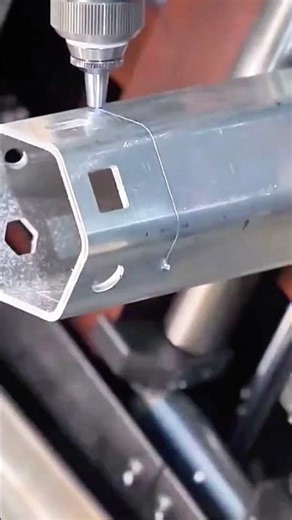 CNC machine drills hex tube with pinpoint accuracy and flying shavings