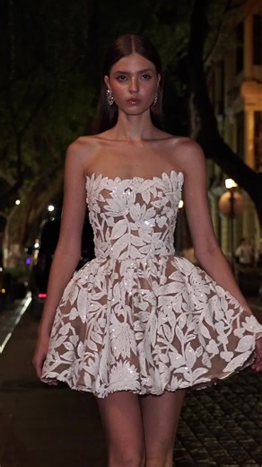 Introducing the Chloe Strapless Mini Dress, featuring a corseted silhouette with a structured peplum skirt and floral appliqué. SS26 Bridal | Look 10 #BRONXANDBANCO #BBWorld #Bridal
