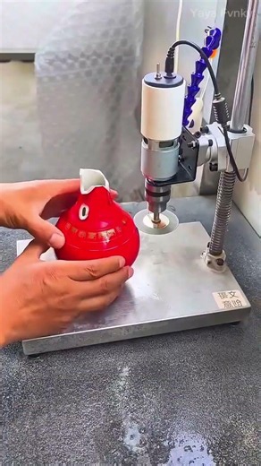 Modifying a Red Ceramic Teapot to Separate the Top and Bottom Pieces Using Tools