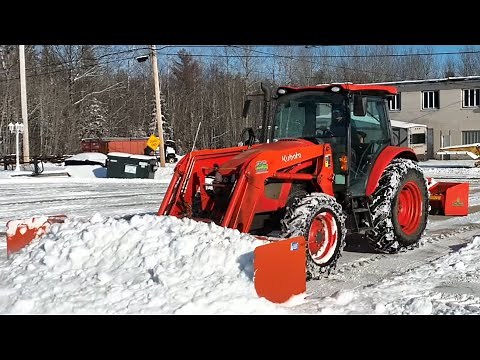 Snow plowing with a Kubota M5 091 Tractor