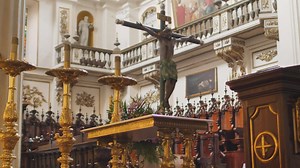 Jesus crucified in front of a church behind the pulpit - Free Stock Video