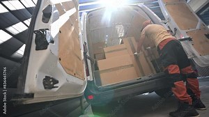 Courier Delivering Boxes Into a Van
