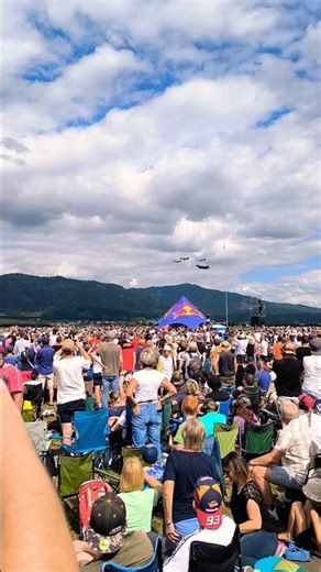 F-35 Fighter jet low pass flying in formation with P-51 Mustang airplanes