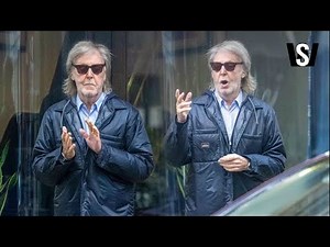 Paul McCartney reveals unruly long grey hair as Beatles legend leaves his office building