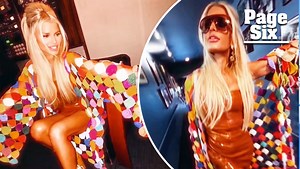 Jessica Simpson stuns in red hot minidress and 'coat of many colors'