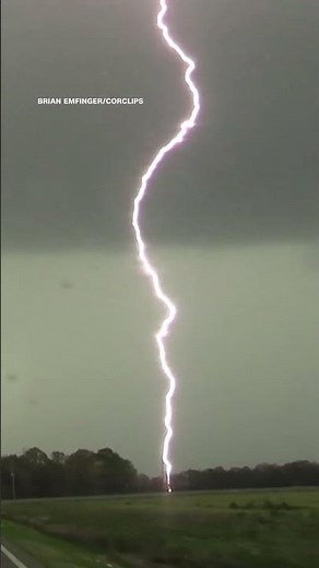 Tornado and lightning tear across the sky in northern Arkansas
