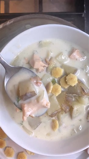 This hearty Salmon Chowder recipe is bursting with amazing flavor. Use fresh, frozen, or canned salmon to make this cozy soup! The recipe is below or comment ‘save’ and I will DM it to you. Ingredients: 3 strips raw bacon, chopped 1 medium onion, chopped 2 ribs celery, chopped 2 cloves garlic, minced 1/4 cup all-purpose flour 1 (8 oz.) bottle clam juice 4 cups whole milk 2 medium Russet potatoes, cut into 1/2 inch cubes 1 bay leaf 1 tsp. salt 1/2 tsp. black pepper 1 lb. skinless salmon, cut into