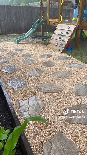 Replying to @probablyapettybitch it drains through the rocks just fine! (so far) We have to redo the patio pavers eventually 🥴 you can see where we messed up #puddles 😅 #rockglue #mulchglue #petratools #tryingtoansweryouall #landscapingideas #treefort #backyardprojects #backyardinspo #shemwellspaces @petratools.com @petramax_