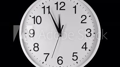 Clock Face Close Up in Time Lapse on black background. Clocks reverse running fast. Clock dial close-up isolated on a black background. Footage is perfect for the layer with different blending modes.