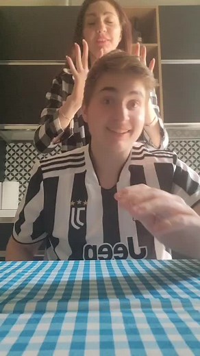 Playful Reactions: A Fun Slapstick Moment Between Friends