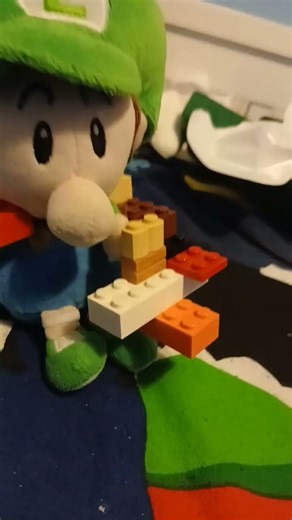 baby luigi as a ghostbuster