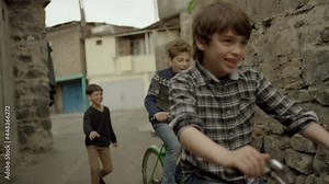 4K. Happy kids, friends riding bikes, bicycles . Vintage times. Memories. Shot on RED EPIC DRAGON Cinema Camera in slow motion.