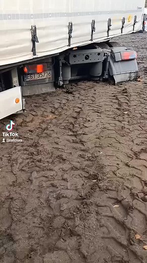 Truck Stuck in Muddy Terrain: Watch the Struggle