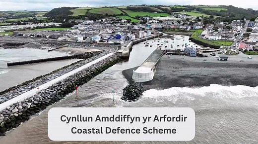 Hello, Aberaeron! 🌊 Here it is – the new purpose-built Coastal Defence Scheme at Aberaeron. Work has now concluded on the flood protection element. You can enjoy Quay Parade once again, and why not take a stroll along the breathtaking new breakwater walkway? Pwll Cam will also open within a few days following final surfacing works. 🏗️The project has involved several technical builds, including constructing sea defences comprising masonry and glass walls, a flood gate and a new breakwater syste