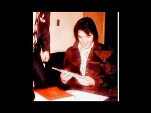 Elvis Presley at Graceland in the jungle room recording in October 1976.