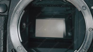 close up of The matrix of the mirror photo camera. The shutter of the camera is working, the resource of the camera shutter, the concept of repair and maintenance of photo equipment