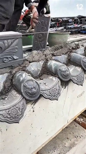 Tile set with care—floral and beast motifs aligned in heritage roof restoration