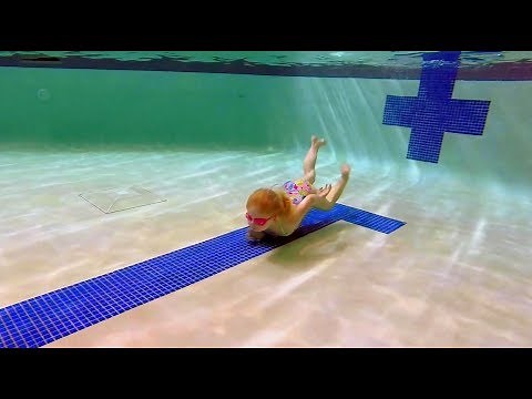 Elizabeth Swims across the bottom of the pool. She tries to swim the length of the pool underwater