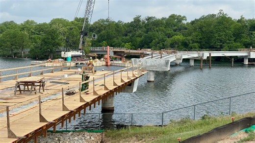 Construction of a new wishbone bridge over Lady Bird Lake is halfway to completion