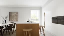 The interior of a light minimalist kitchen-studio with a wooden...