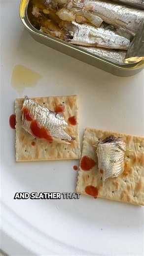 Charlynda Scales | Founder & Author on Instagram: "This is a country snack — Tennessee style. @fishwife Fishwife lemon sardines Saltine cracker @tabasco Garlic Cayenne Tabasco My grandfather (founder of @muttssauce ) raised me in this tradition and taught me to respect great brands — even when they weren’t ours. Now I’m a founder supporting founders, educating you on business, CPG, and how to stay fed while building. Sardines = clean protein, healthy fats, real hunger control. This combo gets it