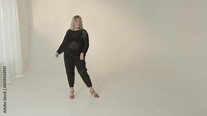 A stunning dynamic dance performance unfolds in a minimalist studio setting, captivating all