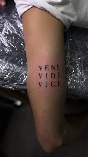 Minimalist 'VENI VIDI VICI' Tattoo — Bold Statement in Black Ink