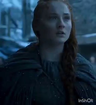 Sansa’s dress in this scene is a major "Easter Egg" for her character arc. She is wearing a hand-stitched cloak featuring the Stark Direwolf. After years of being forced to dress like a Lannister or a Bolton, this was the moment the costume designers signaled that Sansa had finally reclaimed her identity as a Stark of Winterfell.