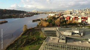 Cinematic 4K aerial drone dolly footage of SODO, the West Seattle bridge, Harbor Island, Duwamish Waterway, Seattle Harbor terminals, Elliott Bay in Seattle, King County, Washington