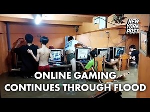 Online gaming addicts in cafe continue playing through typhoon flood | New York Post
