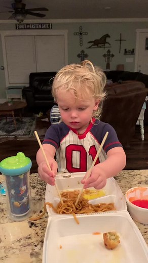 Toddler Mastering Chopsticks at Home Kitchen