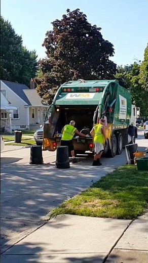 WM Garbage Truck Collecting Trash